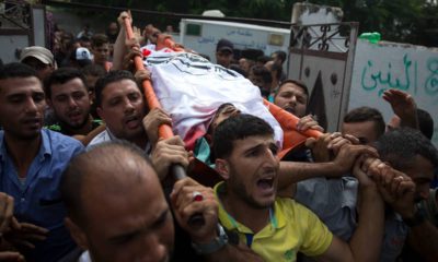 Photo of mourners carrying the body of Palestinian Naji Zaanin, 25