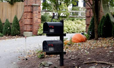 Photo of mailboxes stand outside the entrance to a house owned by philanthropist George Soros