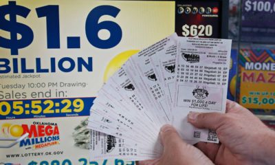 Photo of customer holding Mega Millions lottery tickets in Oklahoma City