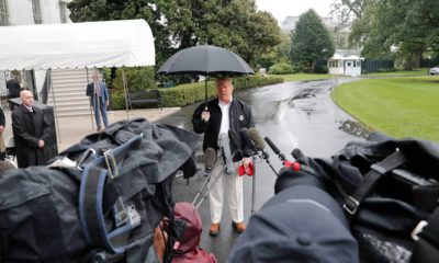 Photo of President Donald Trump talking to media in front of the White House