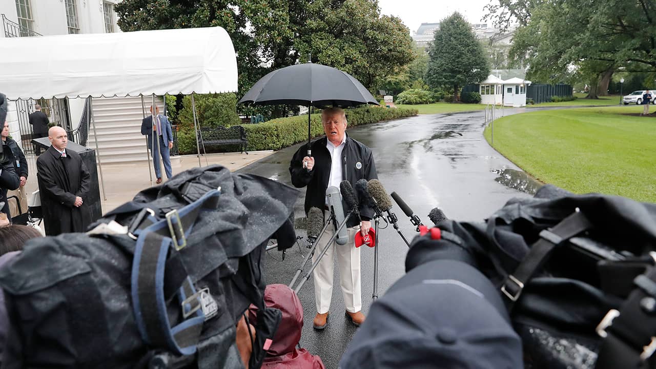 Photo of President Donald Trump talking to media in front of the White House