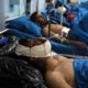 Photo of men receiving treatment after a suicide bombing