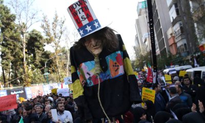 Photo of "Uncle Sam" being held up by demonstrators during a rally in Iran