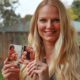 Photo of Diana Sauer holding a photo of her father