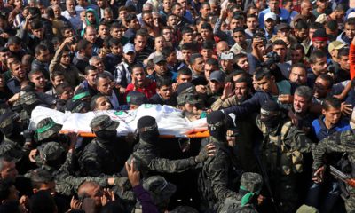 Photo of mourners carrying the body of Nour Baraka