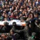 Photo of mourners carrying the body of Nour Baraka