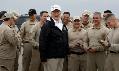 Photo of President Trump with customs and border agents
