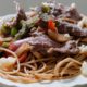 Photo of a dish of steak and cheese pasta