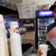 Photo of Gustavo Munoz filling a cup with water