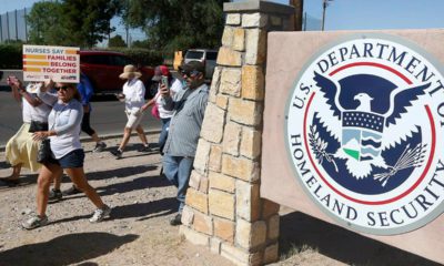 Photo of protesters walking outside the El Paso Processing Center