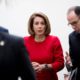 Photo of Nancy Pelosi leaving House Democratic caucus meeting