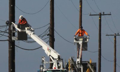 Photo of utility crews repairing overhead lines along the PCH