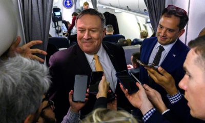 Photo of Mike Pompeo talking to reporters