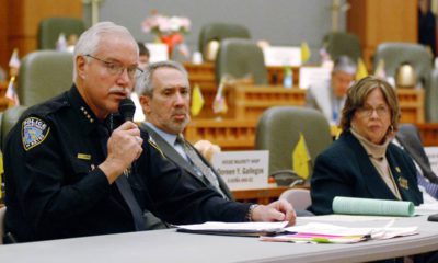 Photo of Mike Heal, left, police chief for the city of Aztec, N.M.