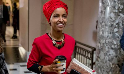 Picture of Rep. Ilhan Omar walking through the halls of the Capitol.