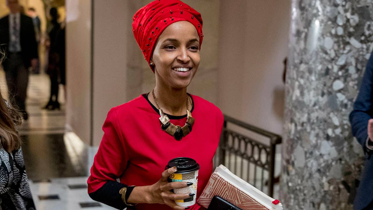 Picture of Rep. Ilhan Omar walking through the halls of the Capitol.