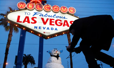 Photo of a snowman near the "Welcome to Las Vegas" sign