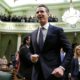 Gov. Gavin Newsom enters the Capitol chamber