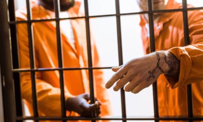 Photo of inmates in a prison cell