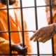 Photo of inmates in a prison cell