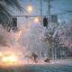 Photo of man riding a bicycle through the snow in Oregon