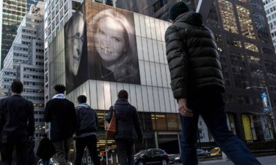 Photo of the building with pictures of Harry Macklowe and his new wife, Patricia Landreau