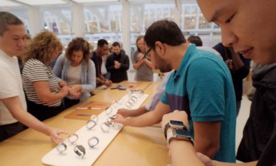 Photo of people looking at Apple Watches in New York