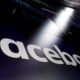 Photo of Facebook logo appearing on a screen at the Nasdaq MarketSite in New York