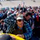 Photo of migrants crossing the river at the US-Mexico border