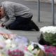 Photo of mourner praying near Linwood mosque