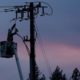 Photo of PG&E line worker at sunset