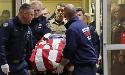 Photo of the body of a Kittitas County Sheriff's deputy draped with a US flag