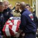 Photo of the body of a Kittitas County Sheriff's deputy draped with a US flag