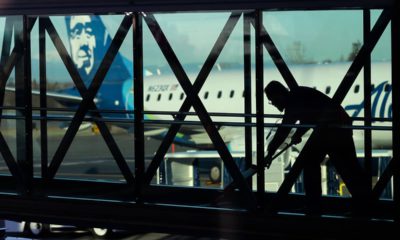 Photo of worker cleaning a jet bridge