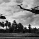 Photo of Vietnam War 'style' B&W image circa 1968 of two helicopters flying low over the rice paddies of South Vietnam looking for Viet Cong insurgents during the Tet Offensive in 1968.