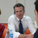 Gov. Gavin Newsom and his wife, Jennifer Siebel Newsom talk with migrant in El Salvador.