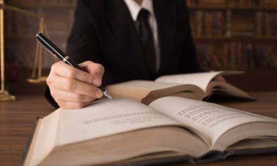 Photo of man writing legislation