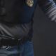 Photo of police officer holding a gun