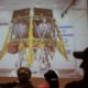 Photo of people watching a live broadcast of the SpaceL spacecraft