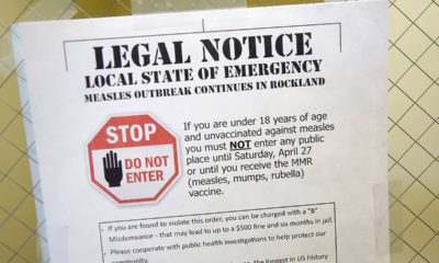 Photo of sign explaining the local state of emergency because of a measles outbreak