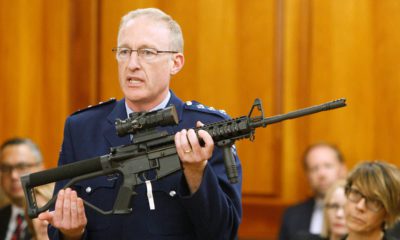 Photo of Mike McIlraith showing an AR-15 style rifle