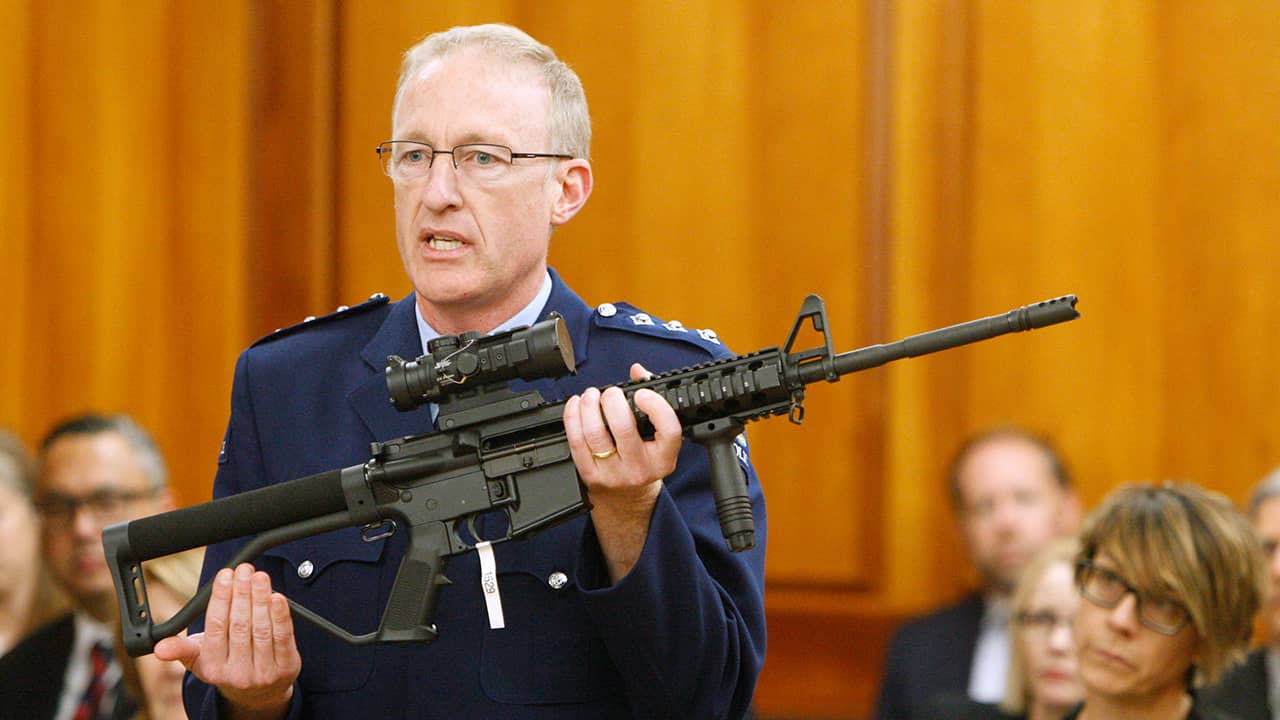 Photo of Mike McIlraith showing an AR-15 style rifle