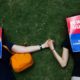 Photo of demonstrators holding hands at the NRA convention