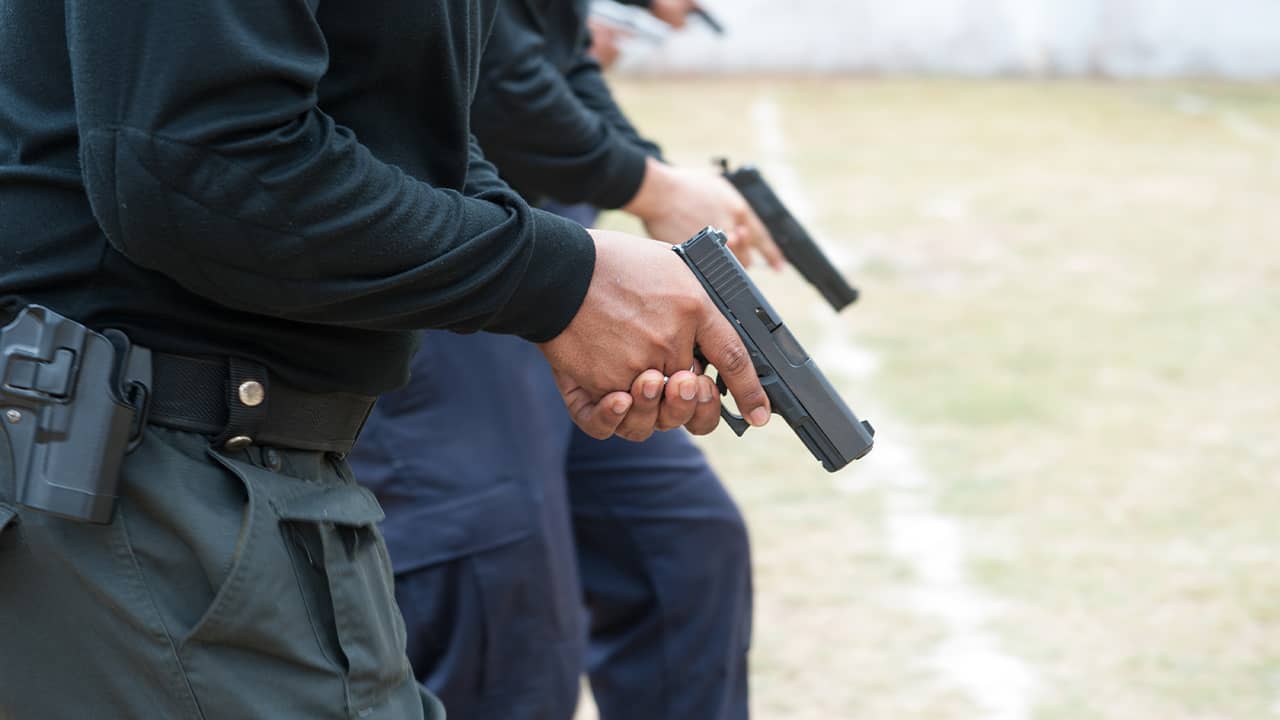 Photo of police with guns