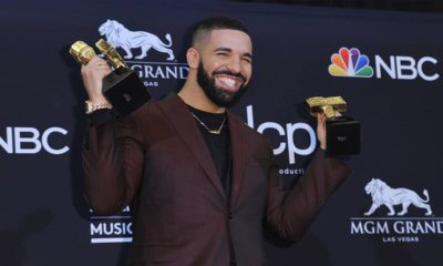 Photo of Drake posing with his Billboard Music Awards