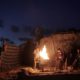 Photo of a Palestinian family outside of their makeshift house