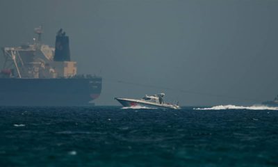 Photo of Emirati coast guard vessel passing an oil tanker