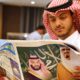 Photo of a man reading a newspaper in Mecca, Saudi Arabia