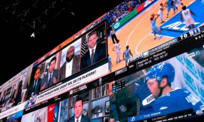 Photo of video screens in a betting lounge