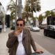 Photo of of man smoking in front of luxury shops in Beverly Hills